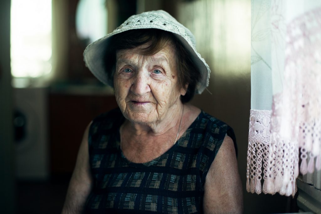 older woman in hat